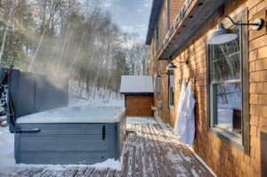 169 South Peak Road back porch with hot tub and sauna.